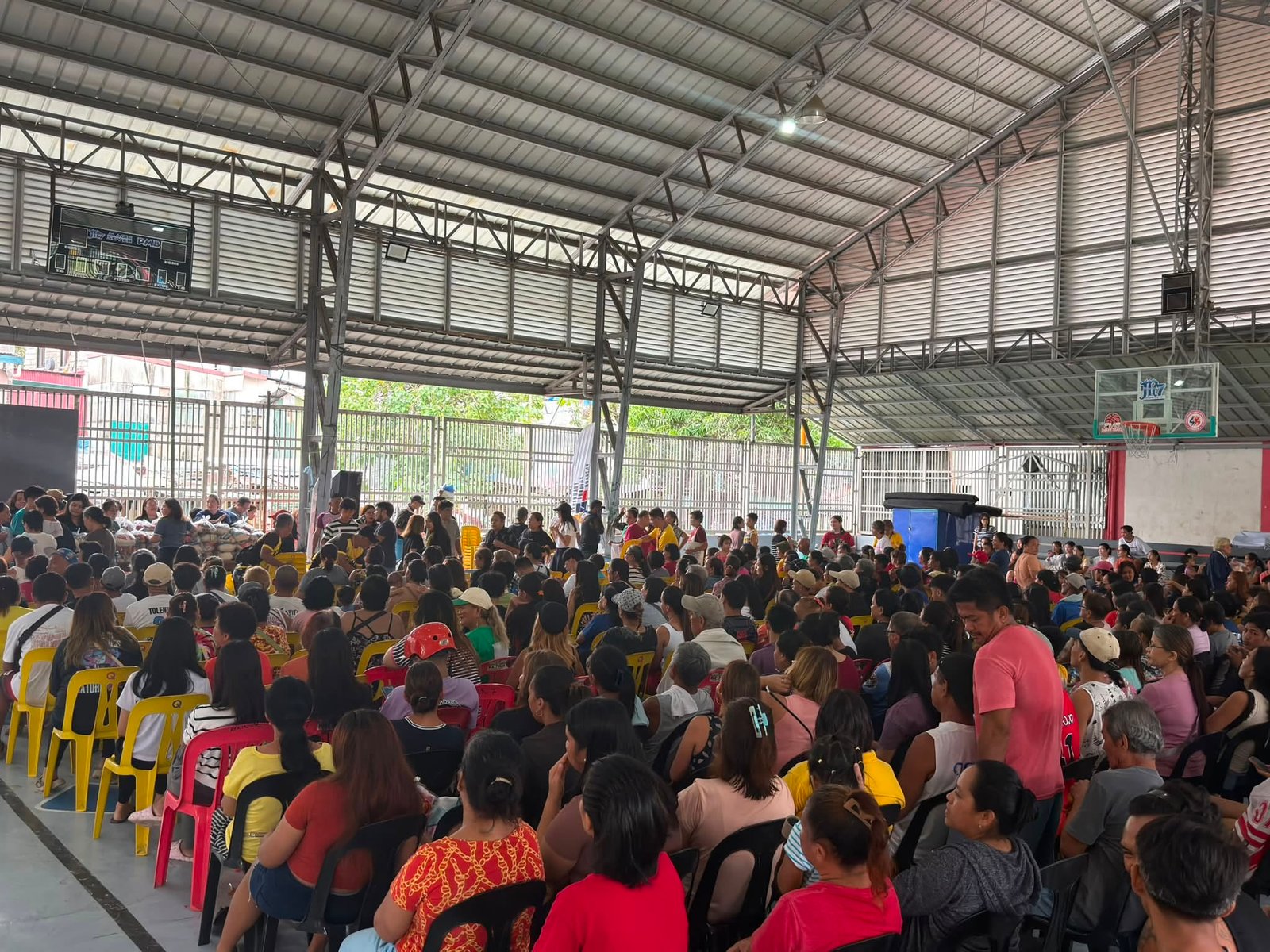 Families gathered during a Legendary Foundation community outreach program